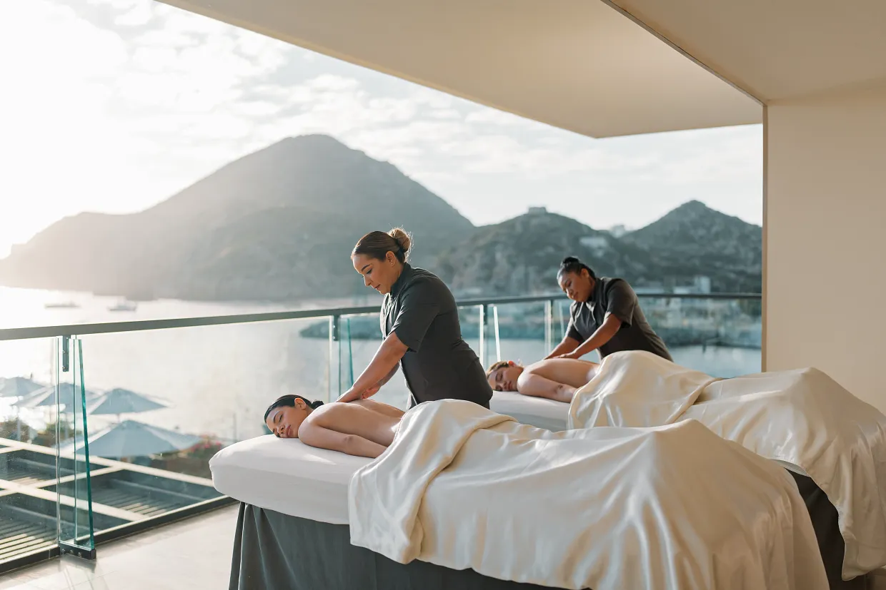 Couples oceanview massage at Breathless Cabo San Lucas Spa overlooking the marina and mountains.